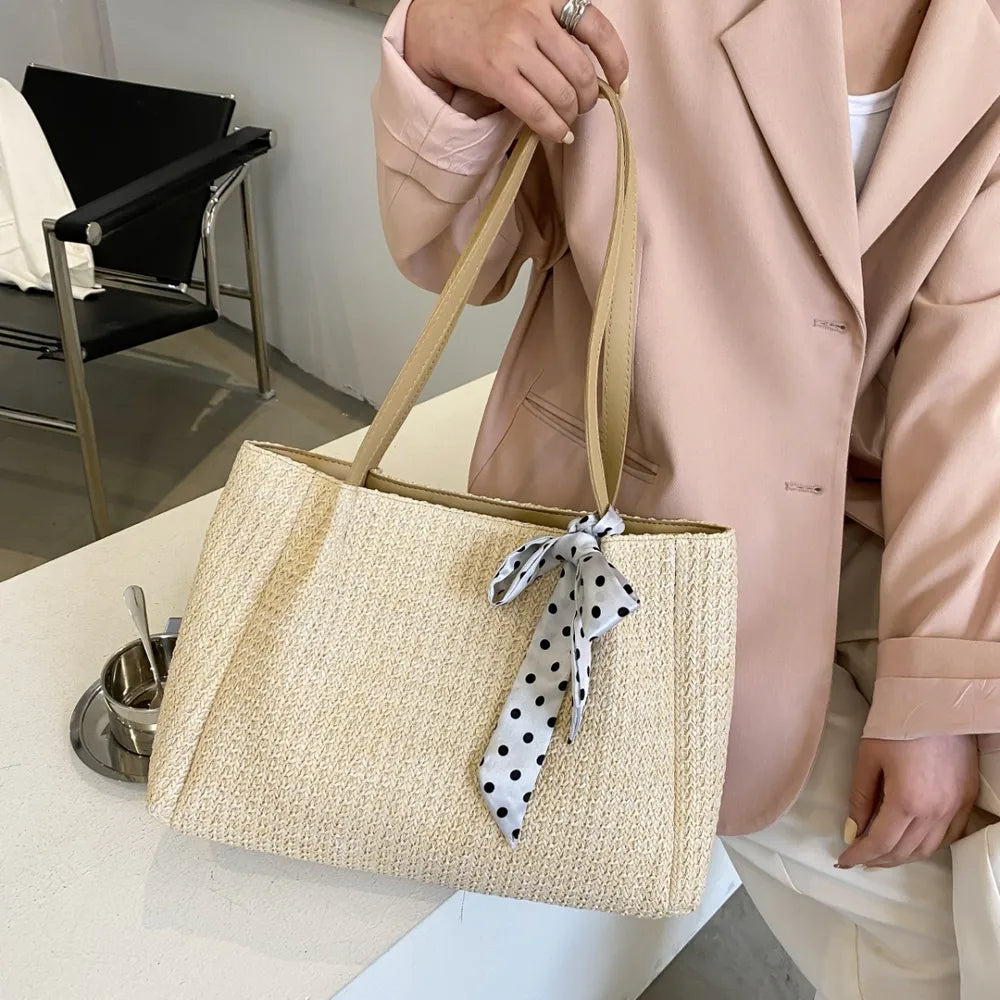 SOLINE – Geflochtene Sommertasche mit Lederelementen & Schleifenakzent