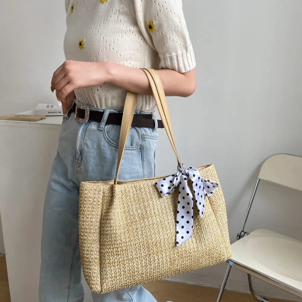 SOLINE – Geflochtene Sommertasche mit Lederelementen & Schleifenakzent